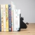 Podpórka do książek czarny kot.