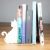 Podpórka Kot Biały utrzymująca rząd książek